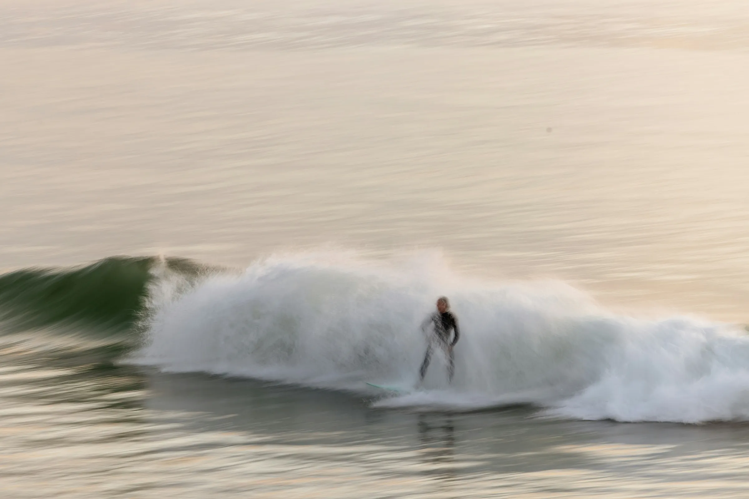 Surfer riding a wave at Cabarita Beach